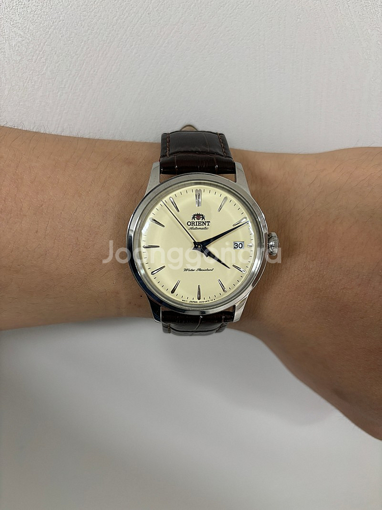 오리엔트 밤비노 크림 38mm 손목시계 팝니다.--0
