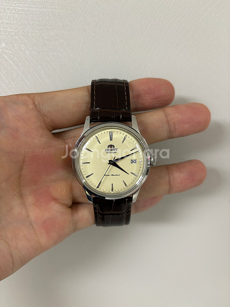 오리엔트 밤비노 크림 38mm 손목시계 팝니다.--1