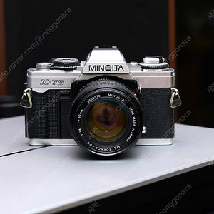 Minolta x70 . 50mm pg f1.4 lens. 35-70mm f3.5 macro lens