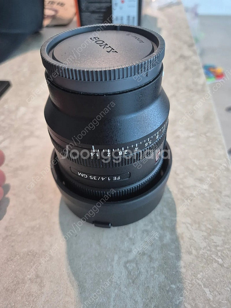 소니 35gm 1.4 렌즈 팝니다(사용을 거의못했어요)--9