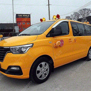 어린이보호차량 더 뉴 그랜드 스타렉스 중고차 노란색 2021년식 57,818km 어린이보호차 LPi 12인승 중고차직거래카페