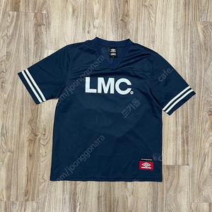 LMC x 엄브로 반팔 져지 100