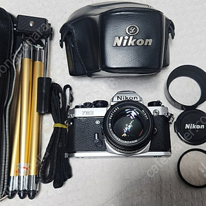 니콘FM2(N신형,Aa급),LR44 2개 전기능OK,NIKKOR LENS 50/1:1.4(5m신형,깨끗함),삼각대,케이스.