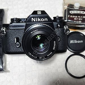 니콘EM(민트급),LR44 2개 전기능OK, NIKON LENS 50/1:1.8(깨끗함), 스트랩, 케이스.