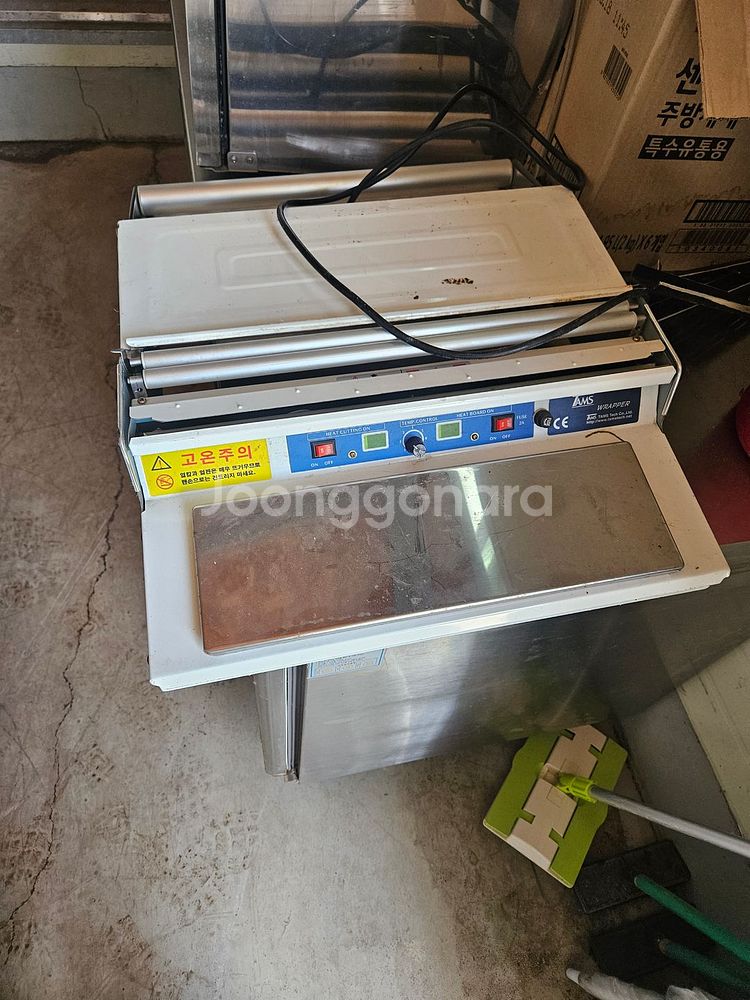 전기 랩 포장기 팝니다.--0