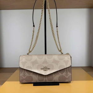 코치 블록 시그니처캔버스 클레어 엔벨로프 크로스바디백