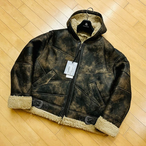 [앤더슨벨] 패치워크 후디 램 셔링 자켓(BROWN)