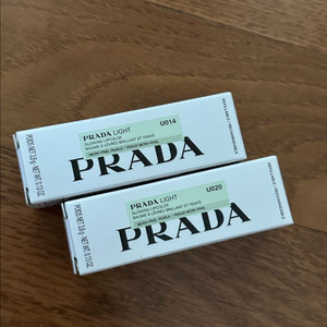 (새상품)프라다 라이트 글로잉 립컬러 판매 화이트,로쏘