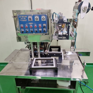 우성 컵실링기 식품 포장기계