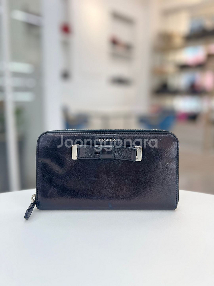 [중고명품 럭스올 울산점]프라다 레더 리본 장지갑 블랙 1M0506--0