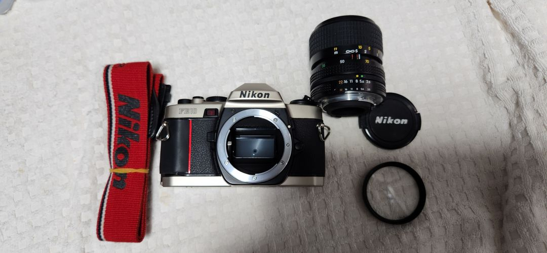 니콘fe10(a급), lr44 2개 기능노출정상 니콘렌즈35~70, 스트랩. 이미지