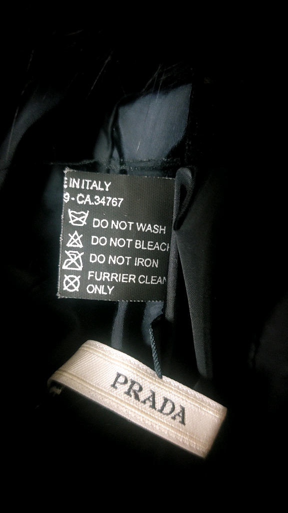 프라다 PRADA 정품 블랙 폭스퍼 트래퍼 햇 (1HC137) 이미지