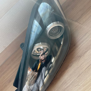 뉴투스카니 운전석 헤드라이트 이미지