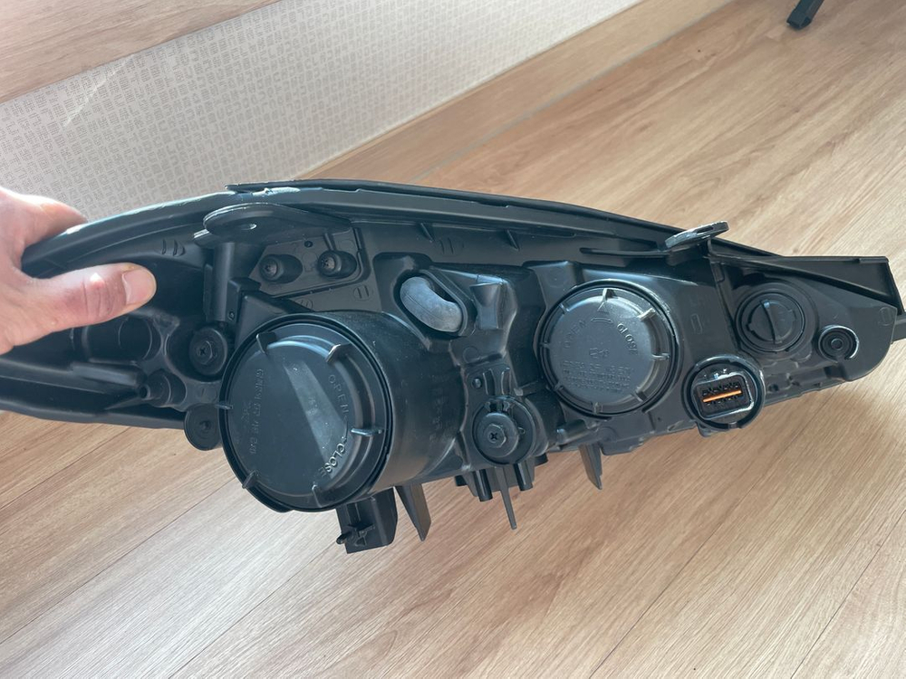 뉴투스카니 운전석 헤드라이트 이미지