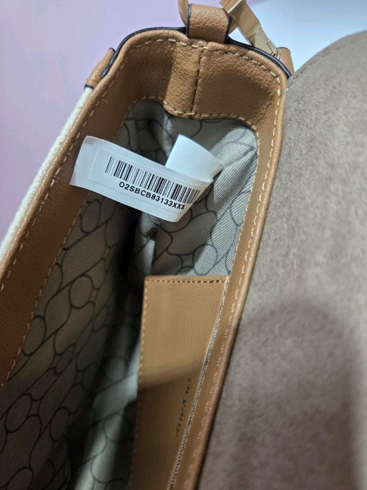 오야니 로티 캔버스 크로스바디 가방 이미지