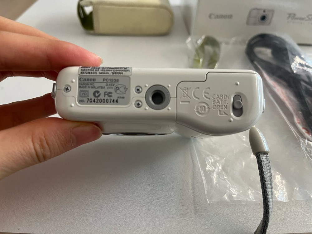 캐논 PowerShot E1 화이트 디지털 카메라 이미지