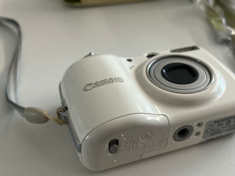 캐논 PowerShot E1 화이트 디지털 카메라 이미지
