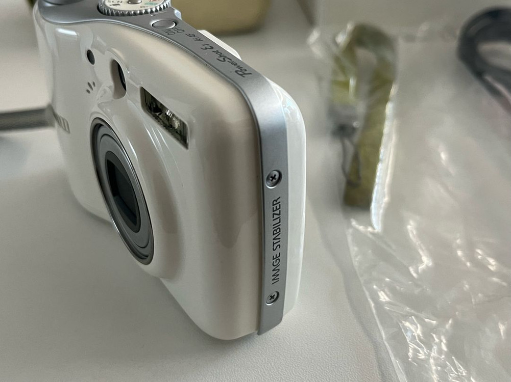 캐논 PowerShot E1 화이트 디지털 카메라 이미지