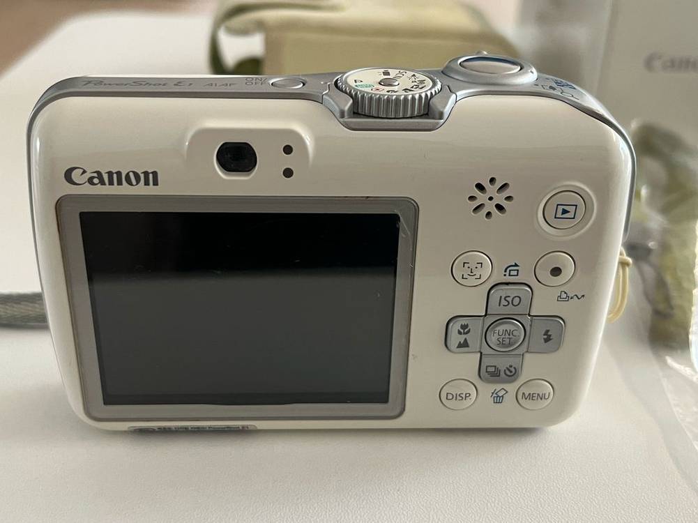 캐논 PowerShot E1 화이트 디지털 카메라 이미지