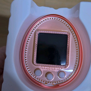 다마고치 4u+ 오렌지 및 통신폰 이미지