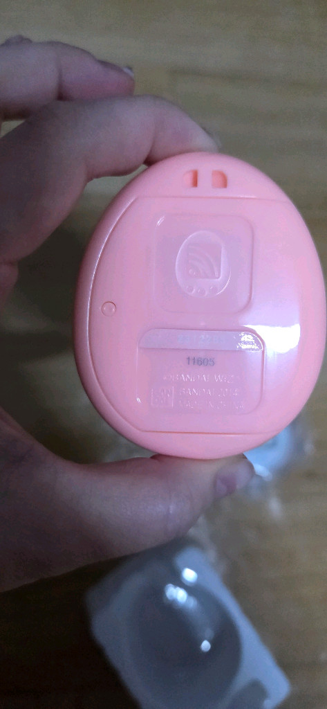 다마고치 4u+ 오렌지 및 통신폰 이미지