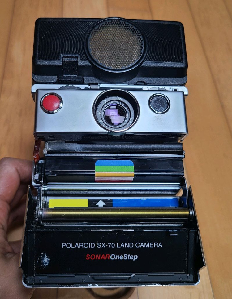 폴라로이드 SX-70 Sonar 네고 가능 영화 광고 이미지