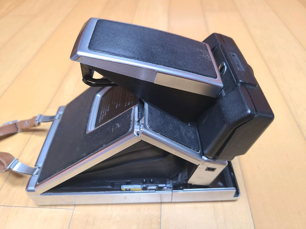 폴라로이드 SX-70 Sonar 네고 가능 영화 광고 이미지