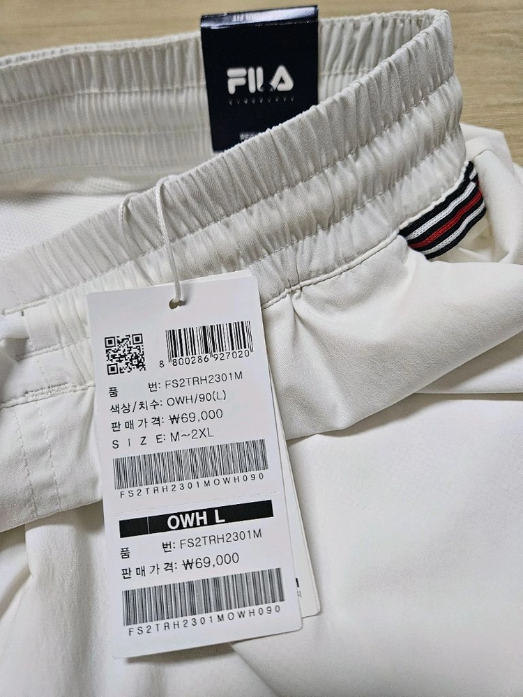 휠라 베이직 4부 테니스 반바지 이미지