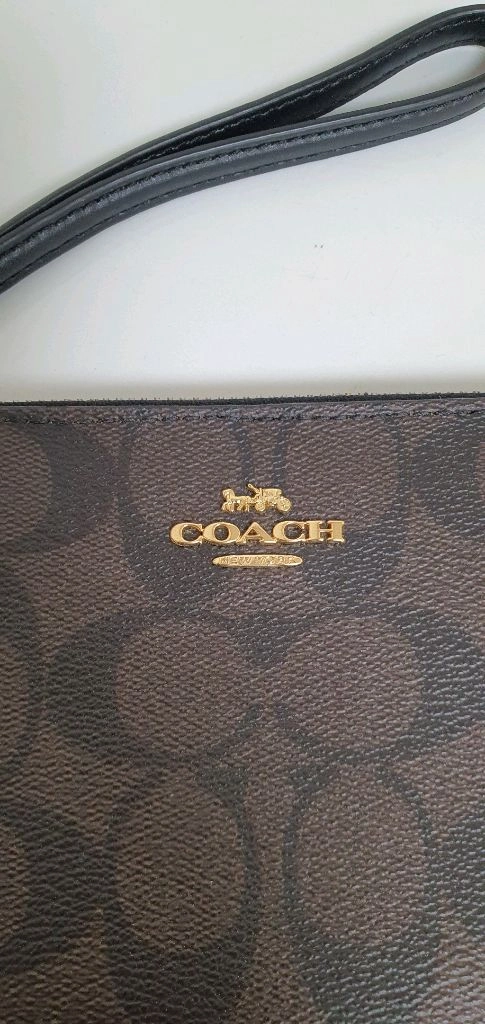 COACH 코치 손목 지갑 이미지