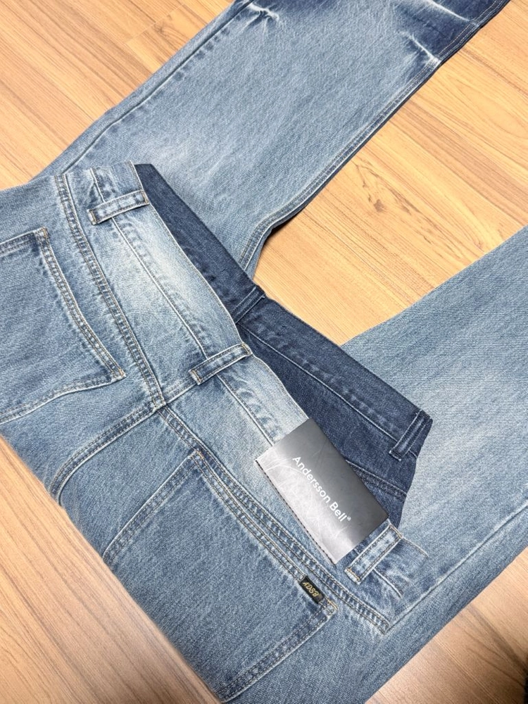 (32)앤더슨벨 UNISEX ASYMMETRIC LAYERED WIDE-LEG JEANS apa871u 이미지