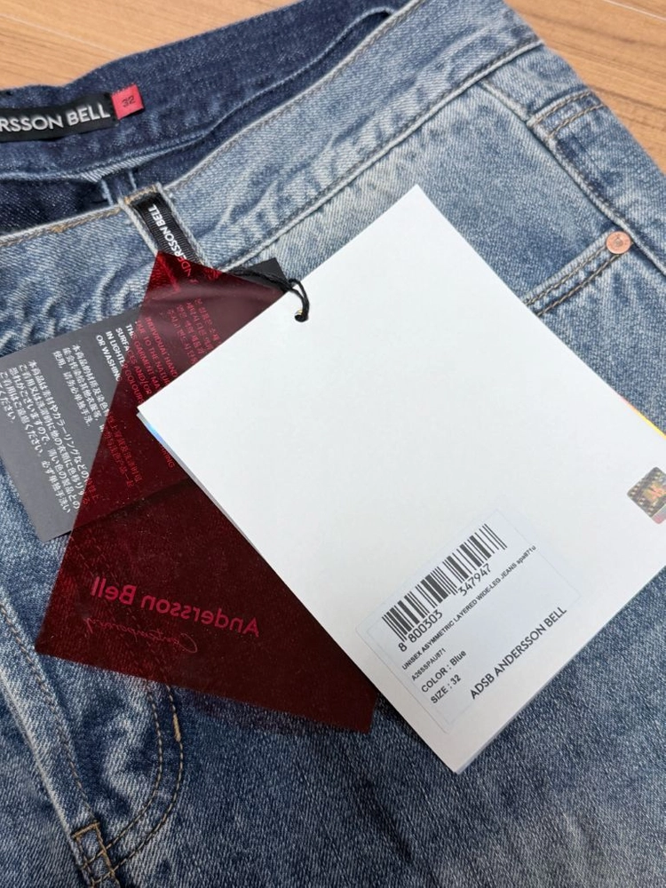 (32)앤더슨벨 UNISEX ASYMMETRIC LAYERED WIDE-LEG JEANS apa871u 이미지