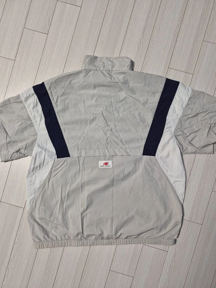 뉴발란스(NEW BALANCE) UNI N플라잉 반팔 아노락 바람막이 자켓 사이즈100L 이미지