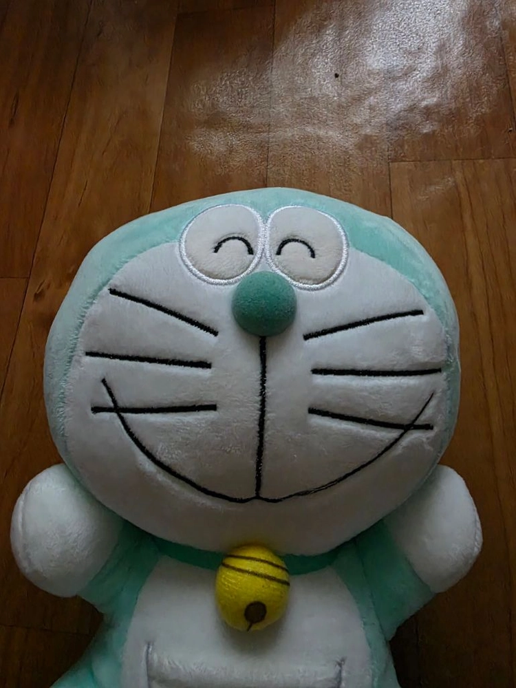 민트색 도라에몽 웃는 얼굴 봉제인형 이미지