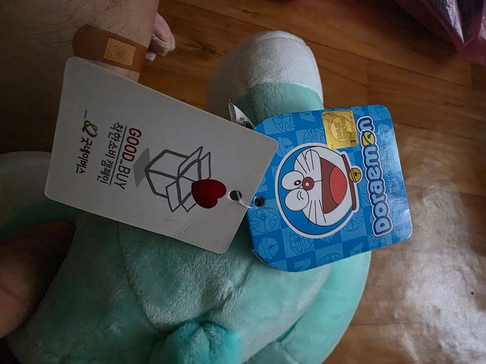 민트색 도라에몽 웃는 얼굴 봉제인형 이미지